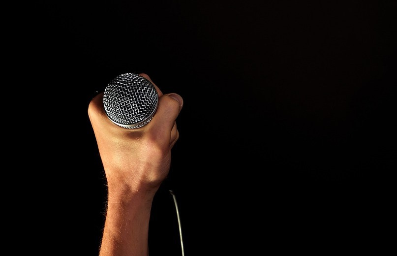 holding mic
